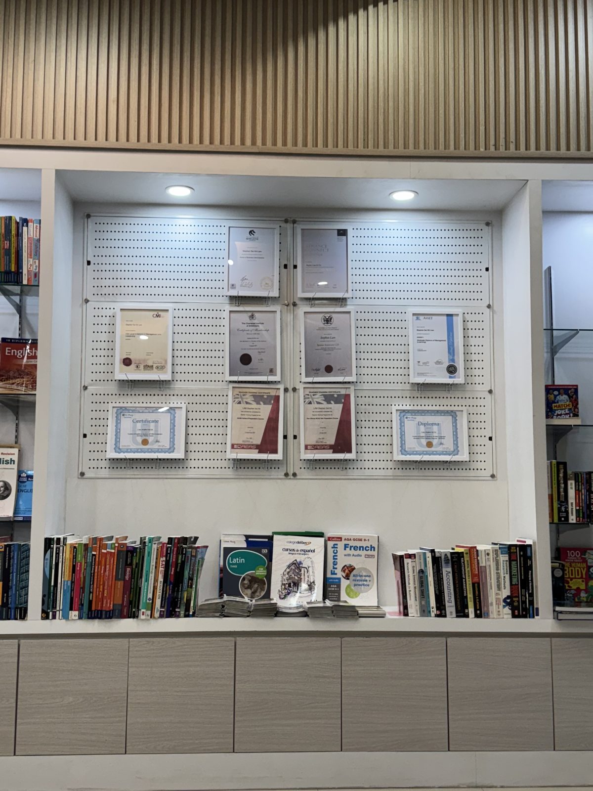 Framed tutor qualifications on display at the centre
